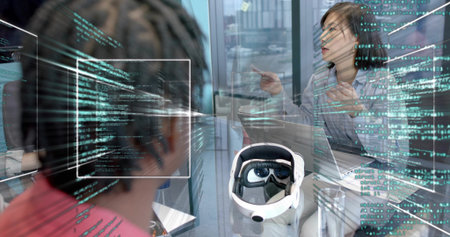 Discussing plans, team in glass room using code overlay, light-blouse woman gesturing, VR headset....