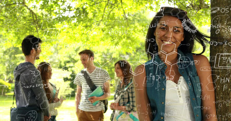 Leaning female student smiling against tree trunk on campus lawn, with notebooks, copy space. Collaborative, friendship, education, outdoors, natural, youth, diversityの写真素材