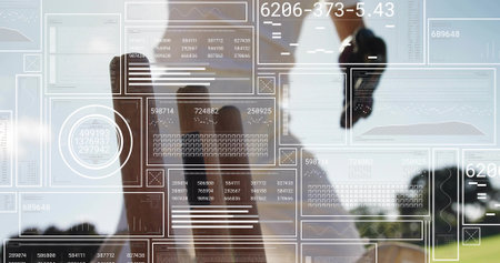 Professional wearing dark jacket and shirt analyzing data on holographic panels in office by window. Technology, innovation, business, finance, analytics, modern, corporateの写真素材