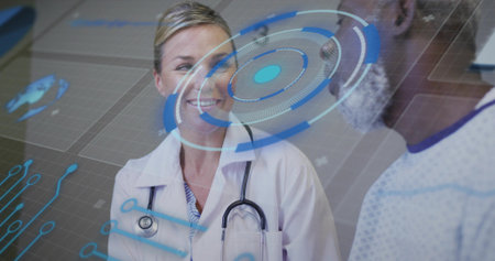 Doctor wearing stethoscope speaking to patient in exam room with holographic interface, copy space....