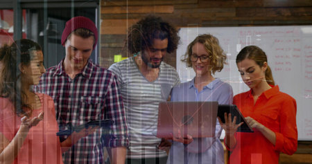 Gesturing coral-blouse woman guiding team holding tablet and laptop near whiteboard in office room. Collaboration, teamwork, innovation, modern, professional, leadership, brainstormingの写真素材