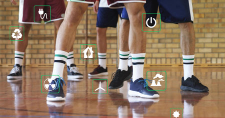 Standing five athletes wearing sports shorts, striped socks on gym court. Athletes, teamwork,...