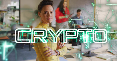 Standing arms crossed mid adult woman in yellow sweater at office desks, copy space. Technology, innovation, team, collaboration, corporate, digital, modernの写真素材