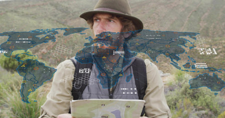 Holding topographic map, hiker scanning hillside with felt hat, backpack straps and digital overlay....