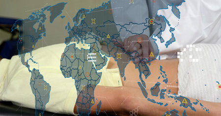 Examining abdomen doctor placing hands on patient on draped table in clinic with map overlay....