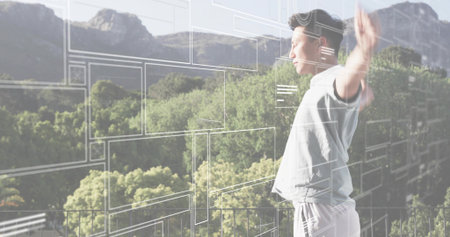 Standing adult Asian man raising arms on balcony railing, using UI overlays, copy space. Futuristic,...