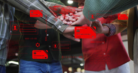 Joining colleagues placing hands in open-plan office, with red credit-card icons and code overlays....