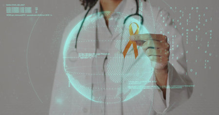 Physician wearing lab coat and stethoscope holding orange ribbon in studio with globe and code. Healthcare, technology, innovation, global, awareness, digital, medicalの写真素材
