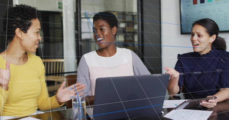 Discussing colleagues exchanging ideas in office with devices water glass, documents and bar charts. Collaboration, teamwork, innovation, professional, startup, modern, corporateの写真素材