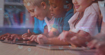 Leaning schoolchildren tapping tablets in classroom, with wooden desk and books on shelves. Education, digitallearning, edtech, classroom, collaborative, futuristic, technologyの写真素材
