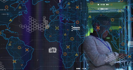 Surveying IT professional wearing gray sweater in data center, with world map display, copy space....