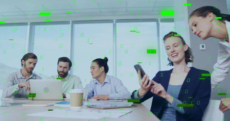 Discussing team wearing suits pointing at laptop and tapping smartphone in boardroom. Collaboration,...