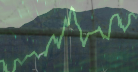 Displaying green chart tracking turbine output over wind farm ridge, with grid markings data labels. Renewable, energy, technology, sustainability, environment, modern, infrastructureの写真素材