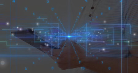 Male wearing striped polo shirt holding tablet presenting holographic panels in simple room. Futuristic, technology, innovation, interface, digital, cybersecurity, data visualizationの写真素材