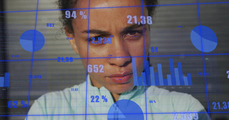 Woman wearing light collared shirt standing in studio, with bar graphs, pie charts and grid lines. Data visualization, analytics, technology, professional, modern, innovation, digital interfaceの写真素材
