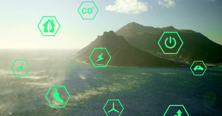Featuring coastal mountain peninsula jutting into ocean, with green hexagon icons and buildings. Sustainability, green energy, environmental, eco-friendly, renewable, blue ocean, coastal terrainの写真素材