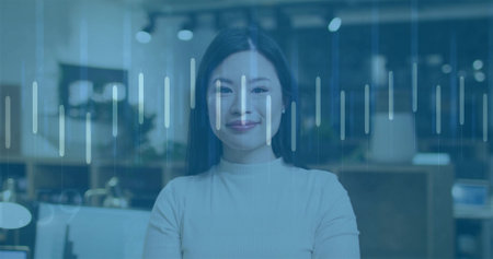 Analyzing data overlay at modern office with monitors by Asian woman wearing turtleneck sweater. Professional, technology, minimalist, corporate, productivity, analytics, workspaceの写真素材