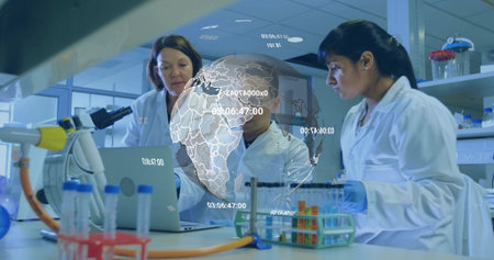Working scientists in lab coats pipetting liquids in lab with tube rack and digital globe overlay....