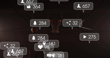 Framing center hoop and incoming ball at gym, showing players in jerseys. Basketball, court,...