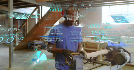 Operating man wearing blue T-shirt gloves turning wood lathe in wood shop, with holographic charts....