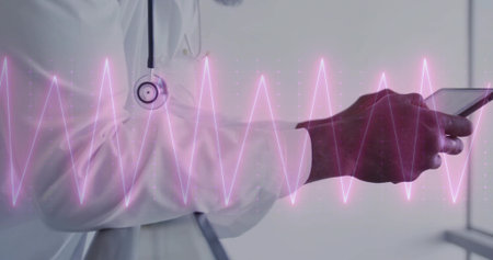 Analyzing doctor in white coat with stethoscope holding tablet in corridor, with pink ECG waveform. Medical, healthcare, digital, technology, professional, hospital, diagnosticの写真素材