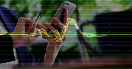 Analyzing woman in blazer holding smartphone and pen at office window desk with line graph overlay. Corporate, data, analytics, professional, modern, productivity, urbanの写真素材