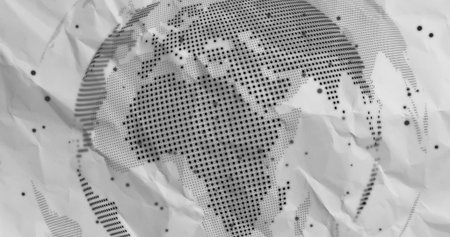 Displaying halftone world map pattern across crumpled paper in flat graphic layout with wrinkles. Topography, cartography, design, abstract, vintage, print, surfaceの写真素材