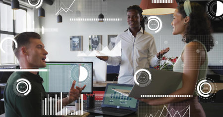 Leading discussion male colleague presenting on-screen data in open-plan office, with laptop. Collaboration, teamwork, innovation, technology, analytics, modernity, productivityの写真素材