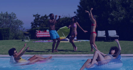 Floating friends in swimsuits on float tubes and dancing at backyard pool, with picnic table. Leisure, outdoor, vibrant, relaxation, social, summer, lifestyleの写真素材