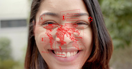 Smiling adult female displaying red world map, login boxes outdoors. Cybersecurity, digital,...