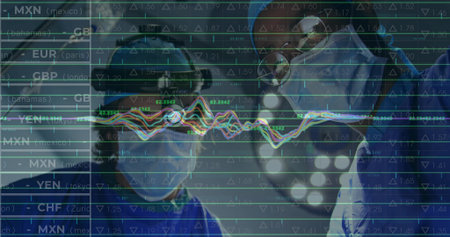 Standing two surgeons wearing scrubs caps goggles masks under lights in OR. Medical professionals, healthcare, innovation, precision, analytics, teamwork, technologyの写真素材