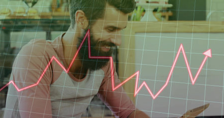 Smiling bearded man in raglan shirt interacting with tablet at coffee shop, neon line graph overlay. Technology, data, analysis, workspace, modern, casual, innovationの写真素材