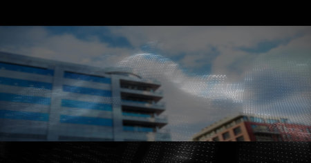 Displaying glass and brick office buildings through downtown street view, with digital wave overlay....