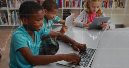 Sitting three students using laptop and tablets at white study table in library, with bookshelves. Learning, education, digital, technology, focus, collaboration, academicの写真素材