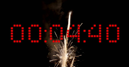 Image of countdown over fireworks on black background. New year, tradition and celebration concept digitally generated image.の写真素材