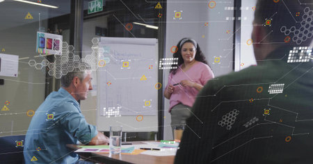 Presenting flip chart woman wearing pink blouse gray trousers in conference room with marker coffee....
