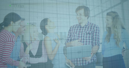 Gathering six office colleagues sharing laptop screen in bright office workspace, with smartphones. Collaboration, teamwork, innovation, modern, professional, communication, technologyの写真素材