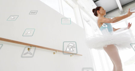 Practicing ballet dancer in blue leotard and tutu in studio, barre and floating icons, copy space. Creative, elegance, contemporary, lifestyle, modern, inspiration, artisticの写真素材