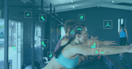 Extending arms woman wearing blue sports bra and leggings squatting at gym, with fitness icons....