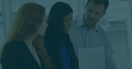 Leaning three professionals in business attire collaborating around laptop computer in meeting room. Business, teamwork, innovation, productivity, corporate, brainstorm, modernityの写真素材