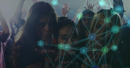 Posing six friends sharing digital overlay under stage lights in dimly lit club, neon icons theme. Nightlife, social, connectivity, vibrancy, entertainment, technology, urbanの写真素材