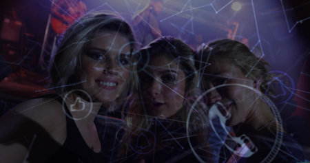 Standing mother and daughters posing at concert venue, with stage lights and digital graphics. Entertainment, socializing, technology, digital, connectivity, vibrant, performanceの写真素材