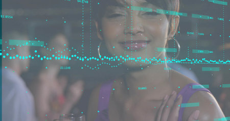 Smiling woman wearing purple top and hoops at lounge, with turquoise data overlay and drink glass. Technology, networking, analytics, data, business, modern, professionalの写真素材