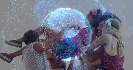 Lifting friend overhead, six adults wearing outfits in studio with holographic network globe above. Collaboration, innovation, connectivity, technology, teamwork, modern, vibrantの写真素材