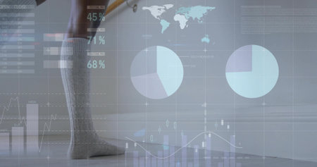 Resting gray socked leg showing digital world map charts on floor near wall, copy space. Minimalist, technology, analytics, data visualization, modern, professional, monochromeの写真素材