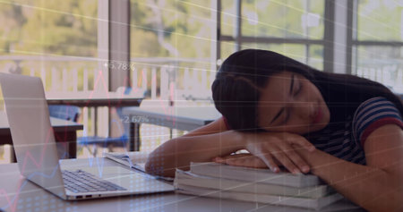 Sleeping Hispanic teen girl on textbooks in study area, with laptop overlooking balcony, copy space. Study, relaxation, tranquility, workspace, education, nature, comfortの写真素材