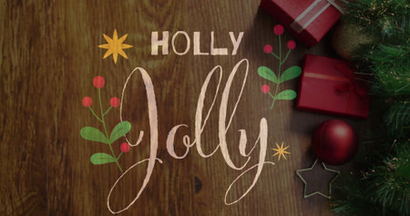 Image of holly jolly text over christmas presents. Christmas, celebration and digital interface concept digitally generated image.の写真素材