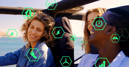 Driving three friends in convertible along coastal road. Adventure, outdoor, leisure, innovation, sustainability, teamwork, modernの写真素材