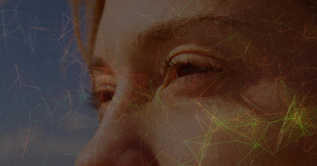 Highlighting woman's facial contours in abstract composition, with glowing network overlay. Technology, innovation, futurism, digital, connectivity, biometric, scienceの写真素材