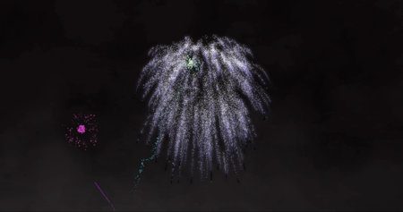 Image of colourful fireworks on black background. New year, celebration and digital interface concept digitally generated image.の写真素材